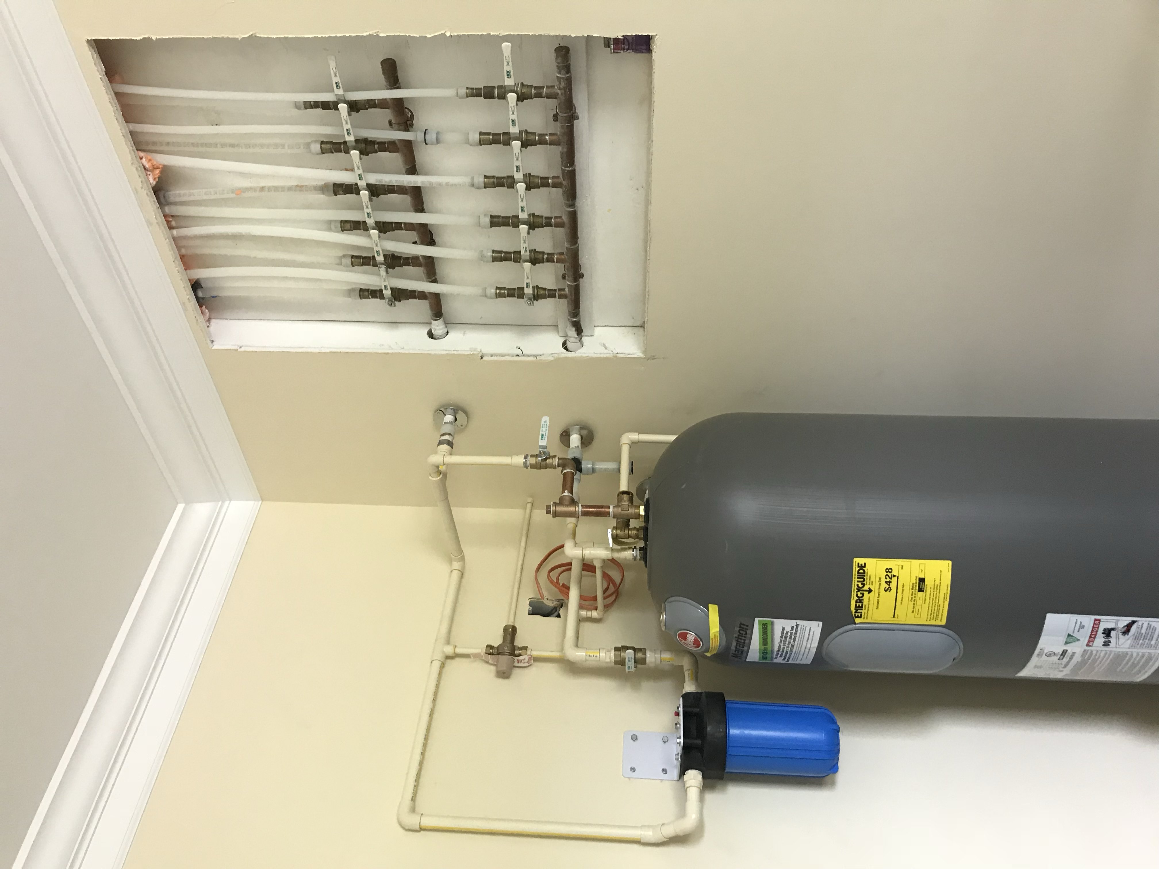 A completed water heater and repipe installation